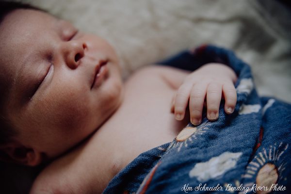 A newborn sleeping more from the family's free sleep program consultation from The Woman's Place.